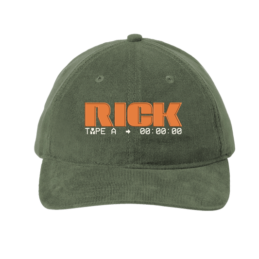 This image features the RICK Corduroy Hat in a solid green color. The hat is crafted from 100% cotton, providing a soft and durable fabric.